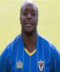 Adebayo Akinfenwa Signs Off In Style As AFC Wimbledon Earn Promotion To League One