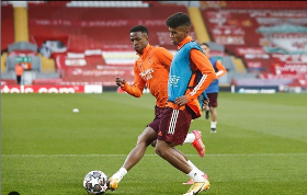 Photo Confirmation : Akinlabi trains with Real Madrid at Anfield ahead of Liverpool match