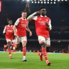 Gunners Invincible Kanu celebrates Arsenal
