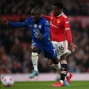 Shoretire watches proceedings from the bench as Manchester United share the points with Chelsea