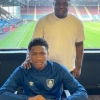 Photo : Nigerian defender completes transfer to Burnley Youth; Huddersfield, Ipswich, Boro miss out